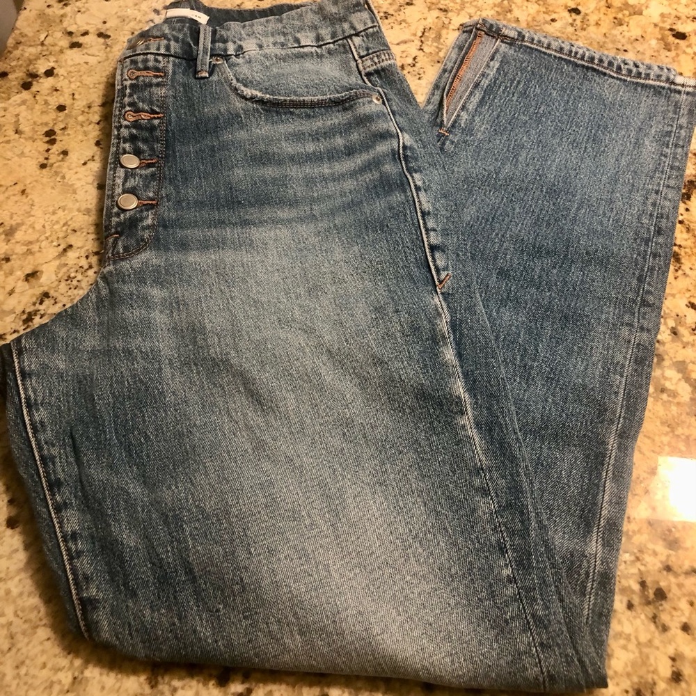 GOOD AMERICAN exposed button fly jean s with slits. Lighter wash. Great conditio